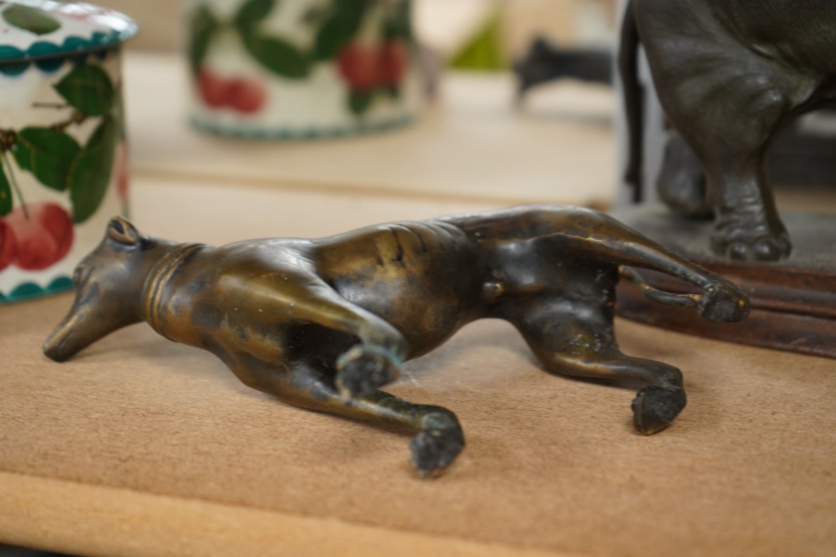 A bronzed metal model of an elephant and a bronze model of a greyhound, tallest 20cm